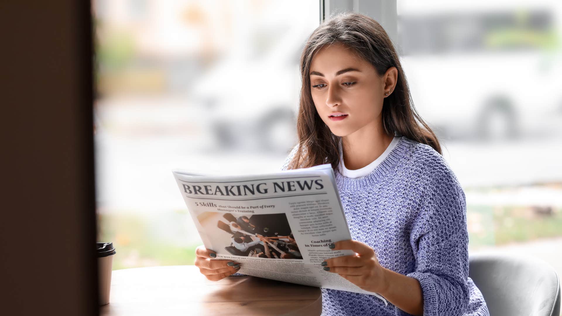 woman in purple shirt believes that the local news is worth supporting