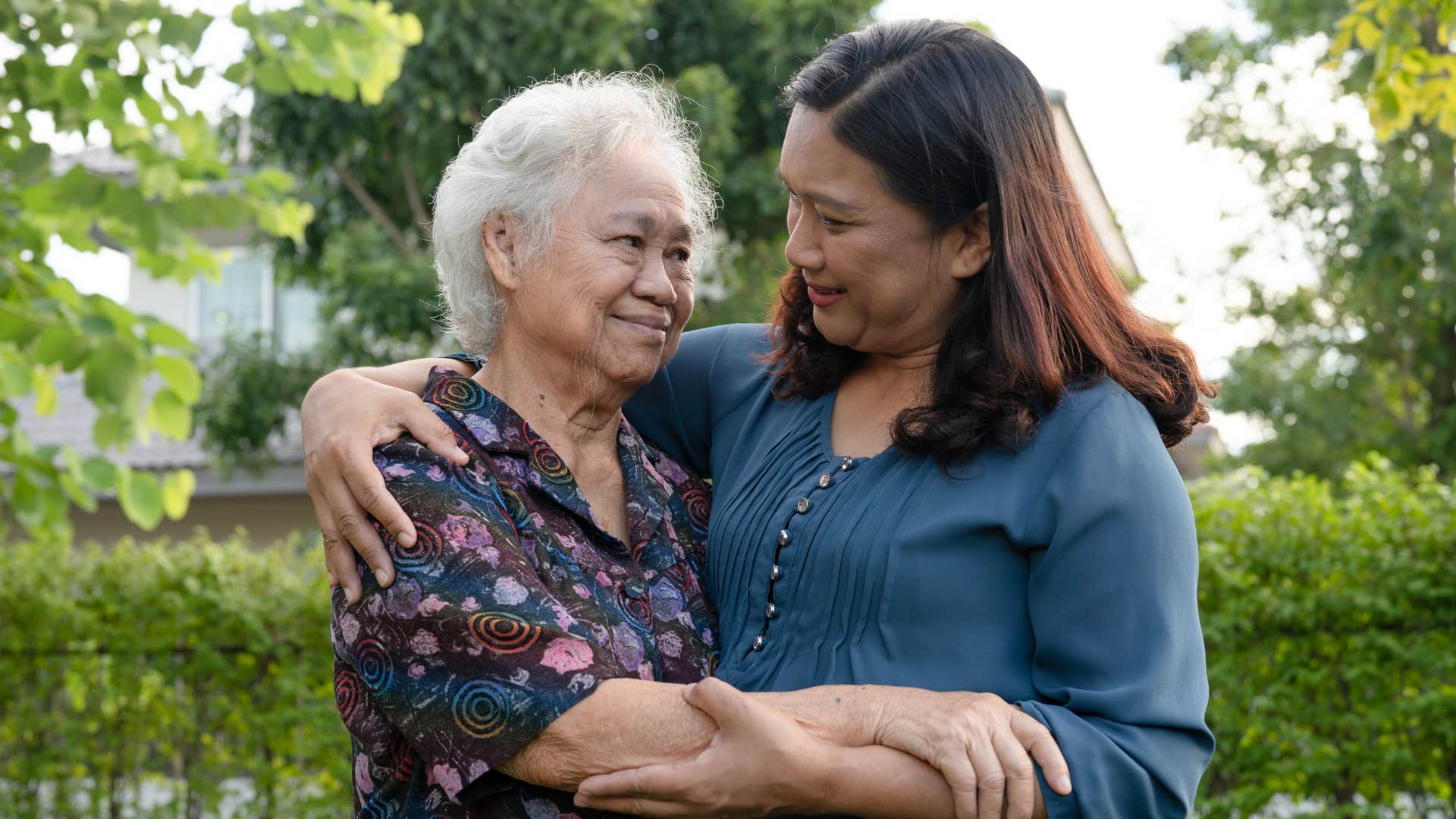 woman hugging older woman respecting her elders