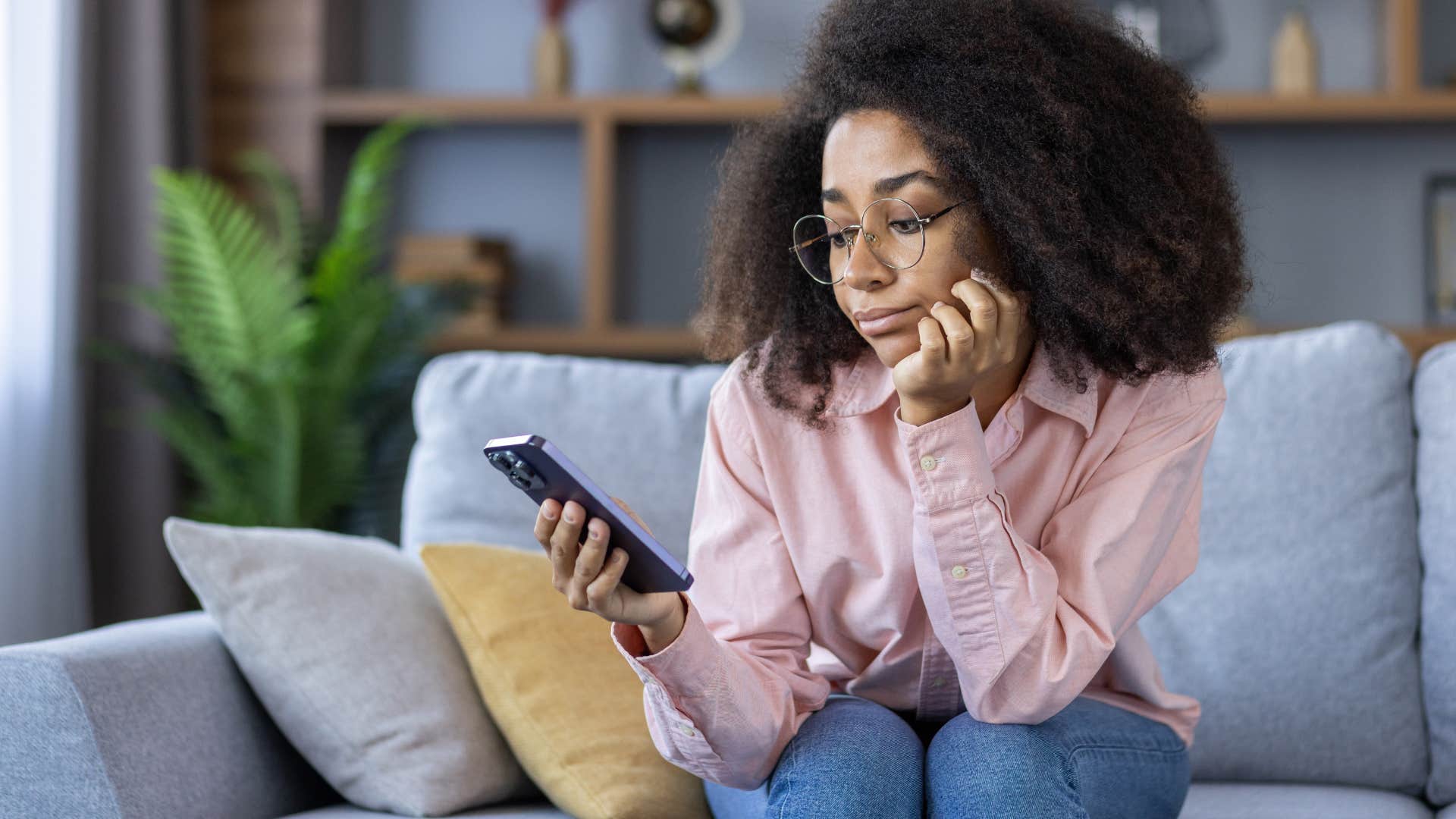 woman looking at her phone