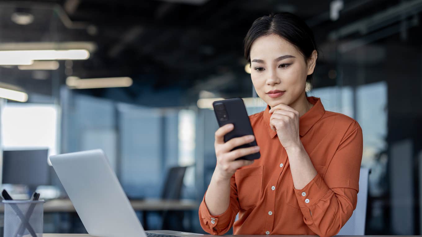 businesswoman on her phone in office