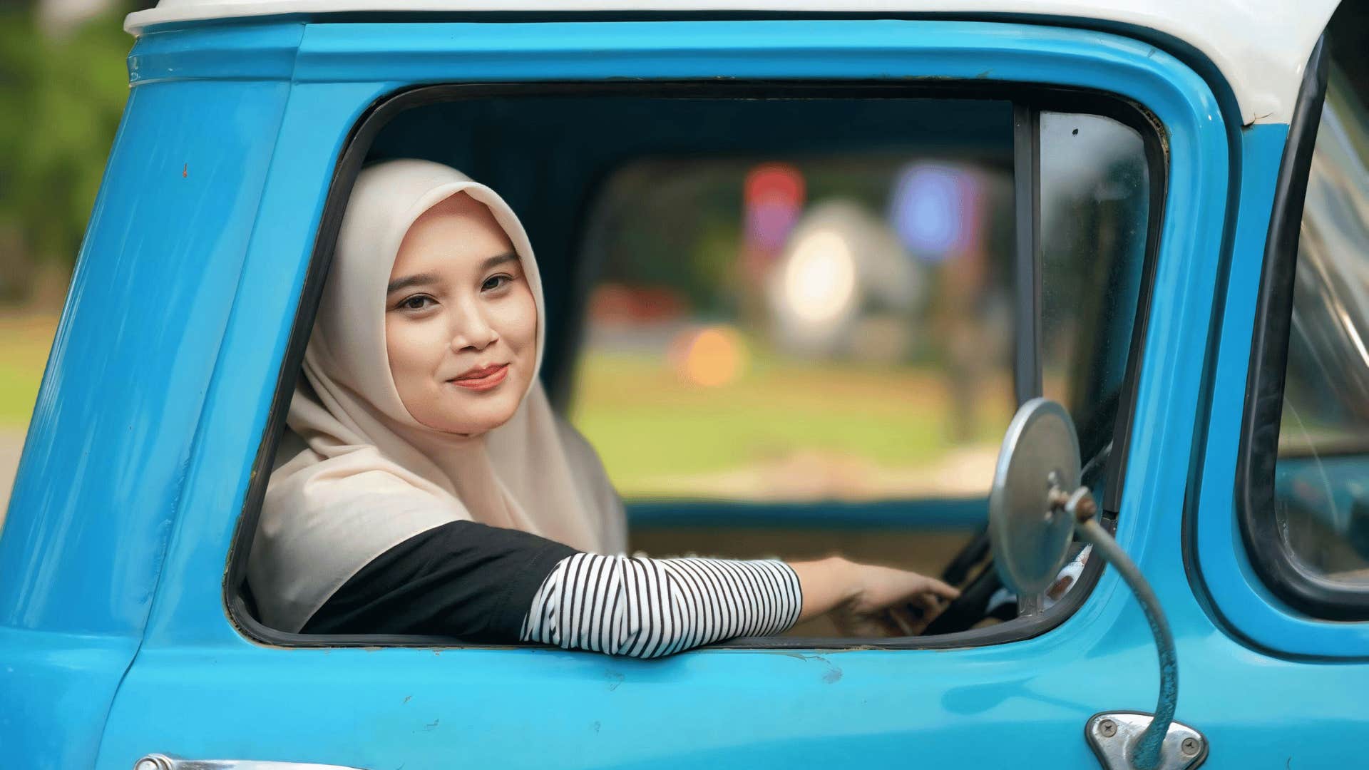 independent woman riding in the back of a truck