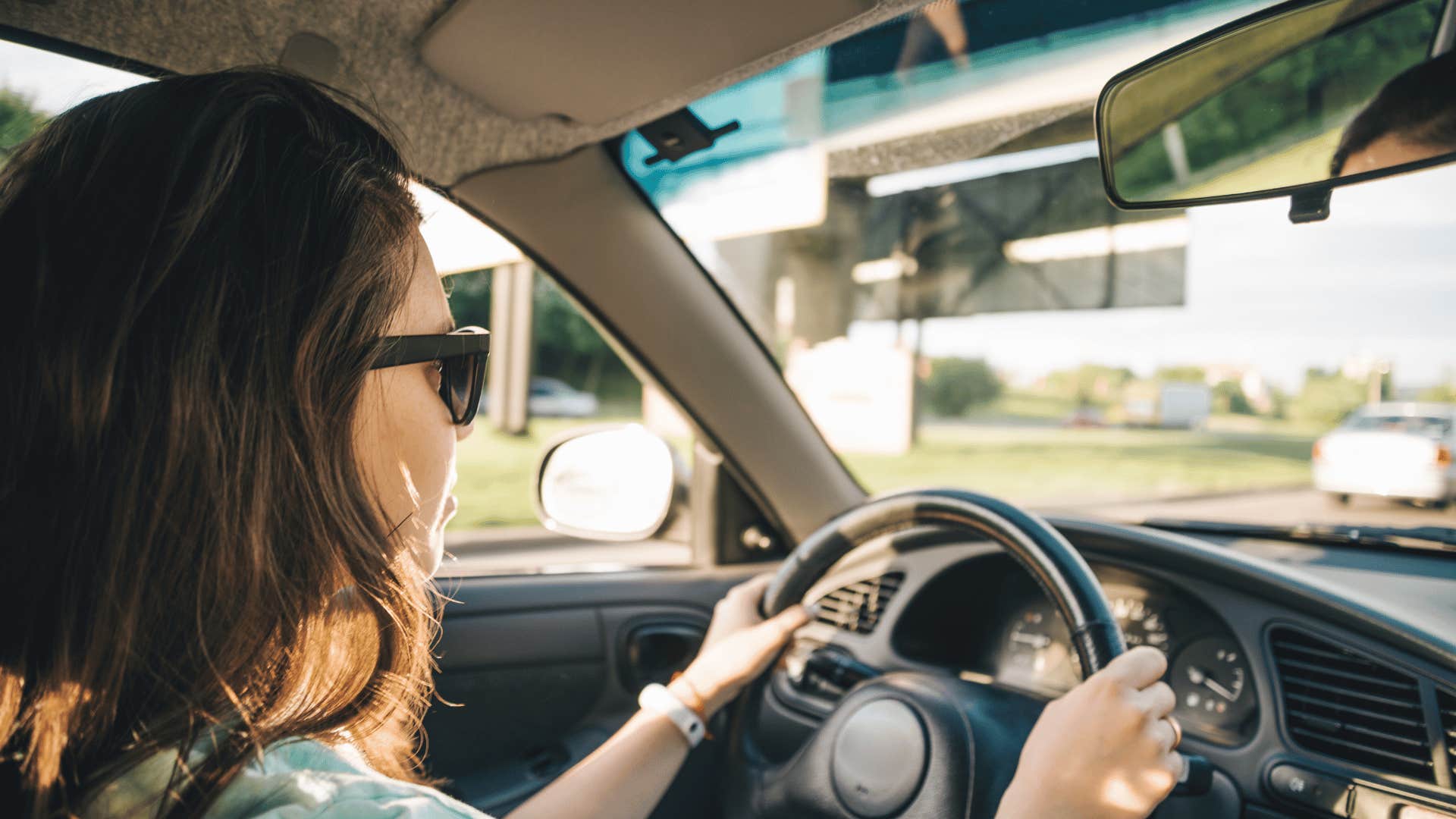 stressed woman driving without listening to music