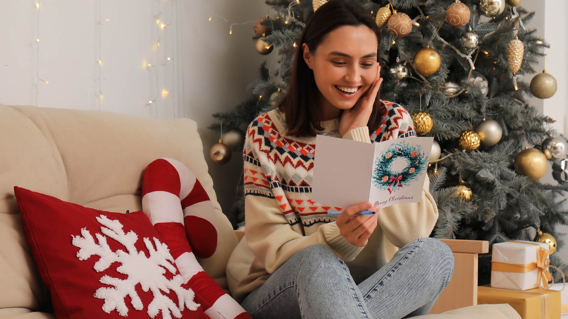 woman who's keeping a tradition going looking at holiday card