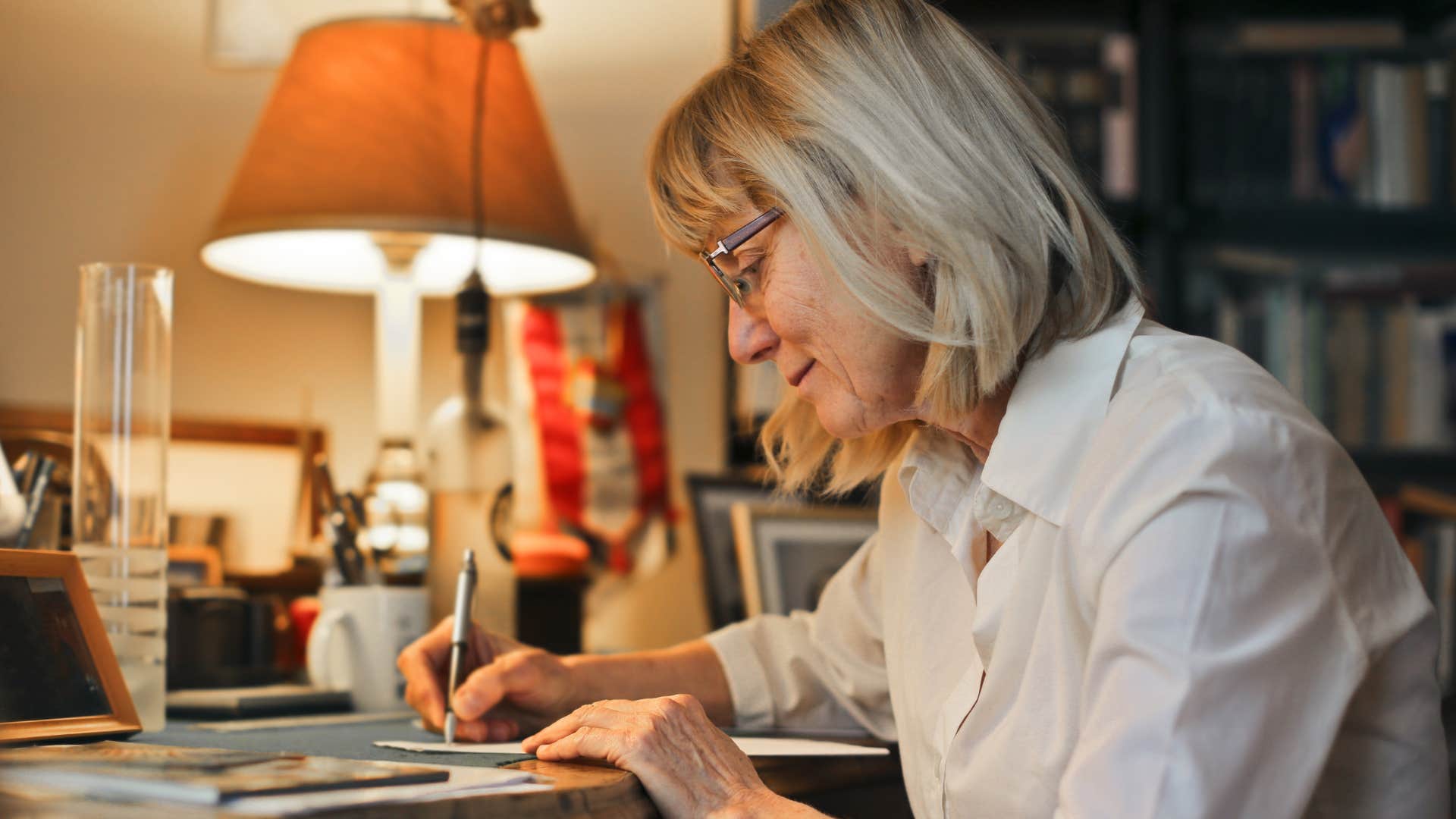 perfectionist woman writing holiday cards at home