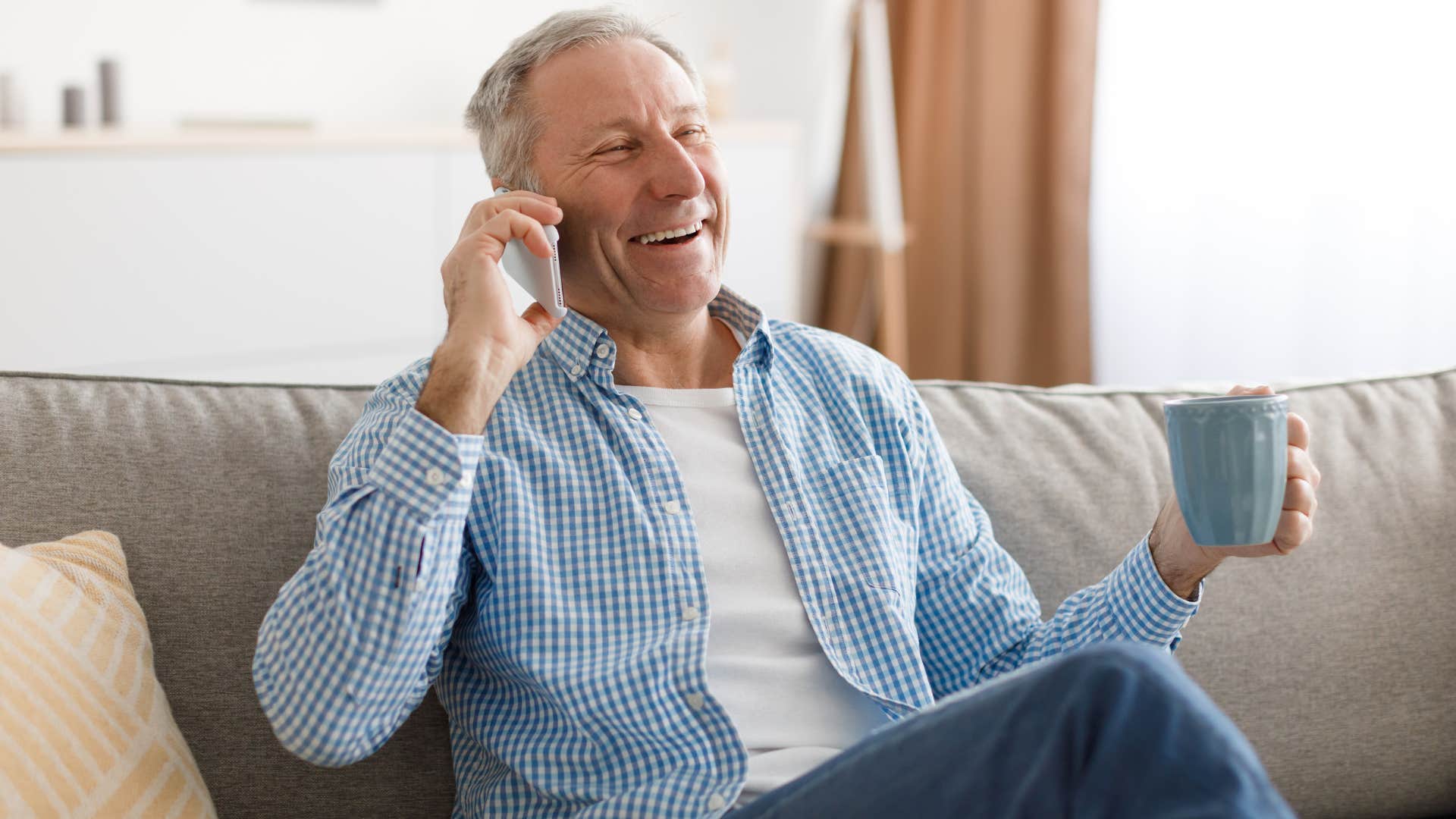 man who appreciates reassurance from others talking on phone