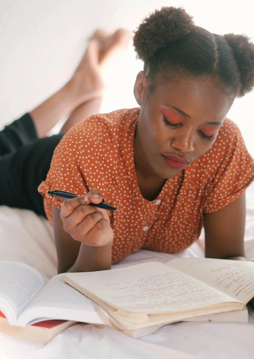 woman writing things down by hand