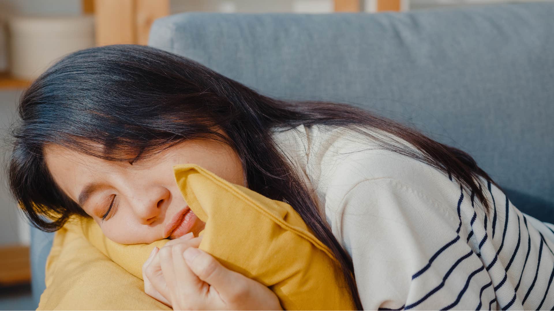woman with strong personal boundaries sleeping on the couch