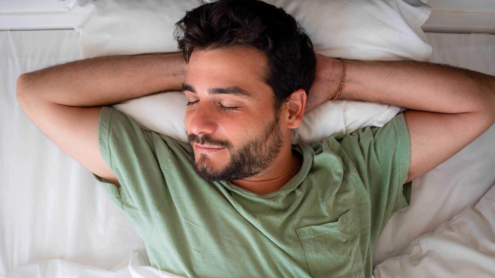 peaceful man napping in bed