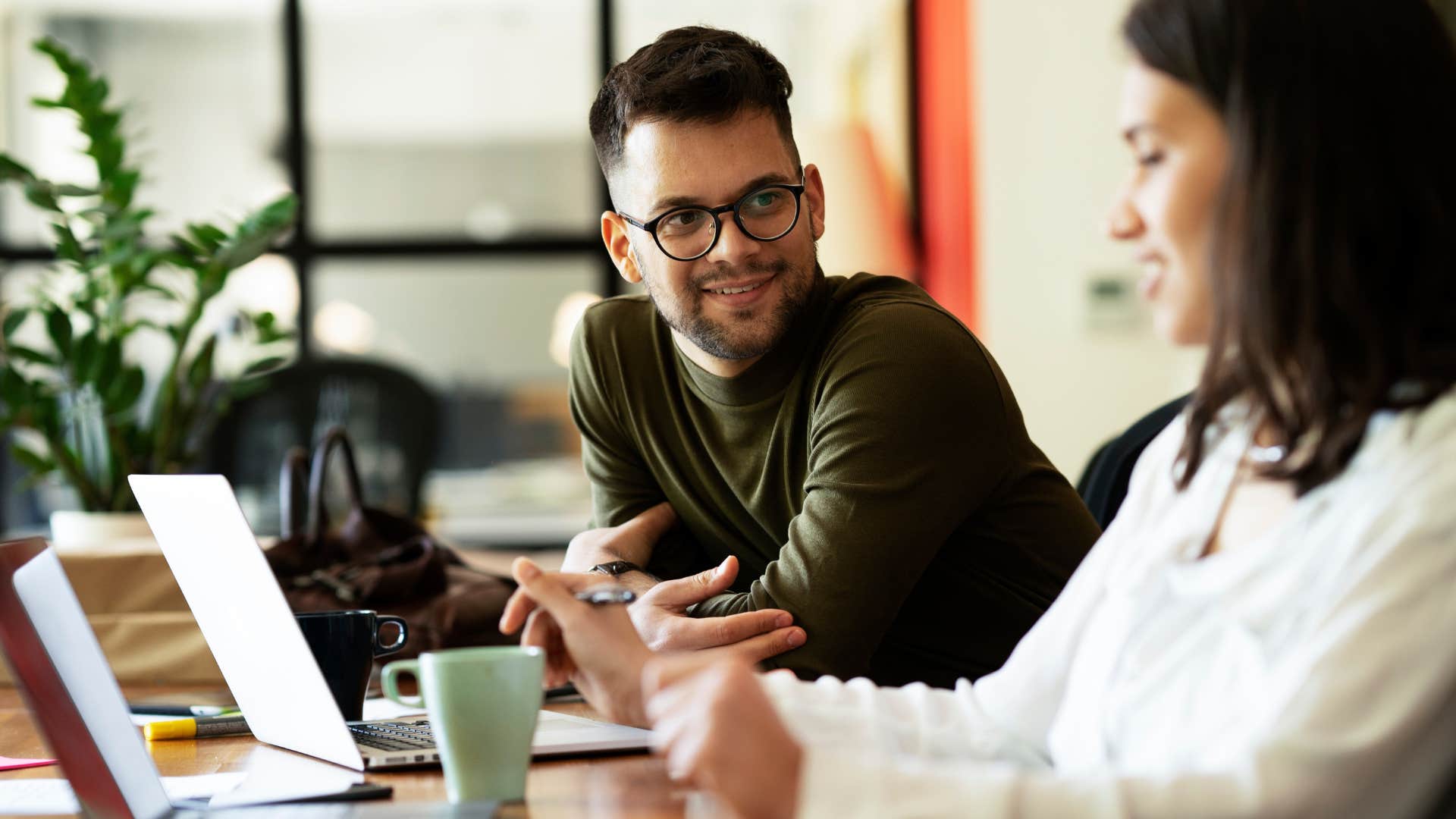 man simplifying complex topics talking at work