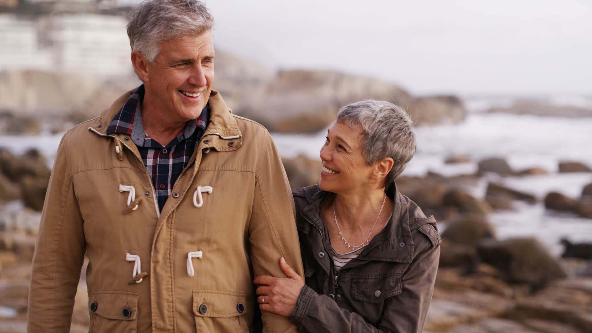 couple smiling and taking long walk outside