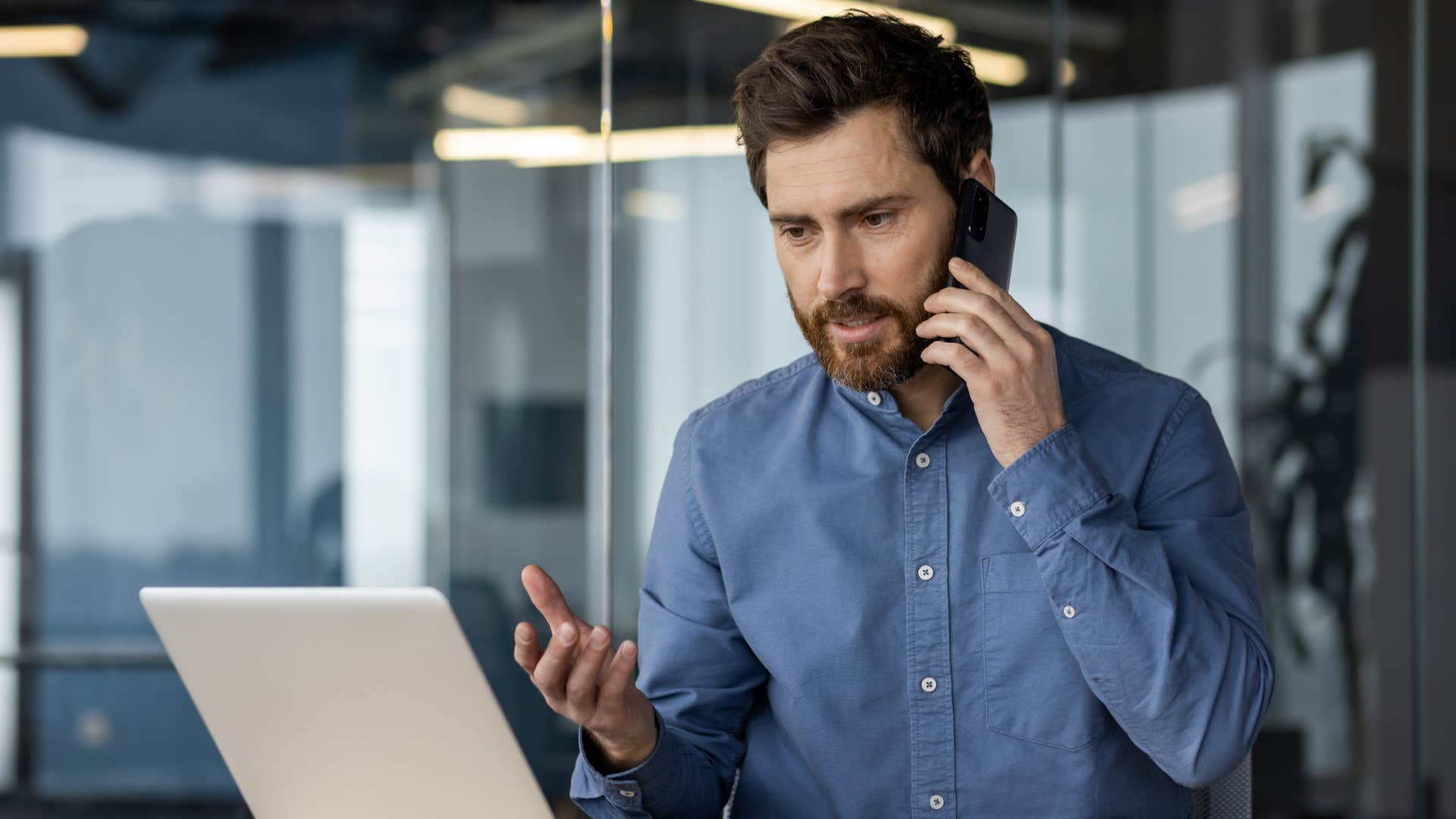 sad man trying to stay busy at work