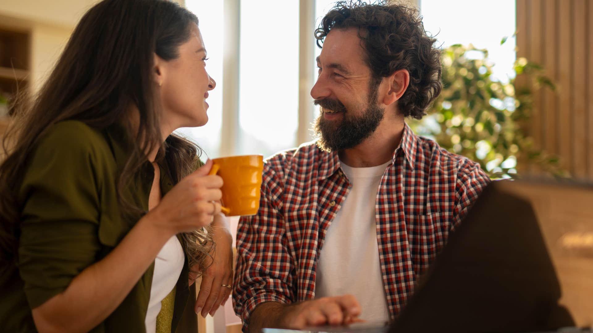 couple saying i love you to each other over coffee