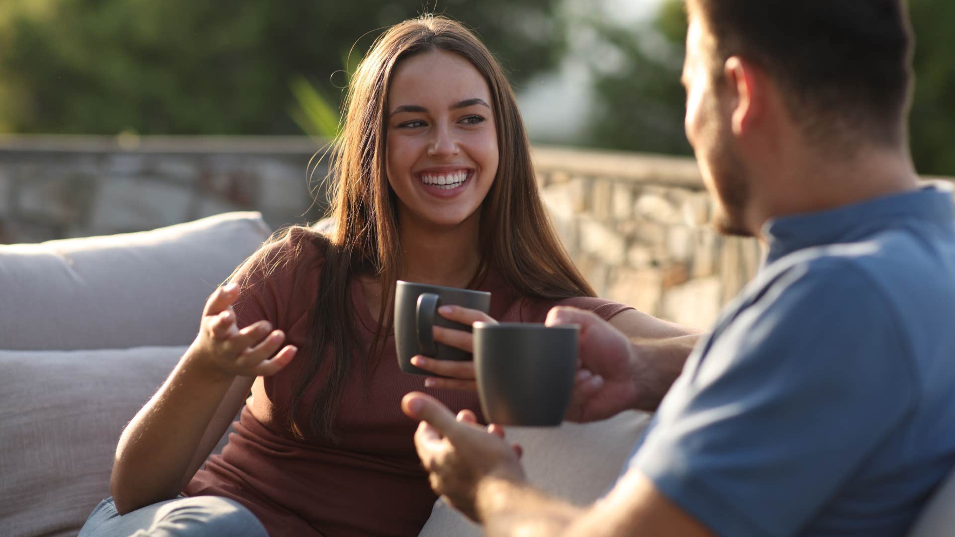 woman saying thank you to her partner over coffee