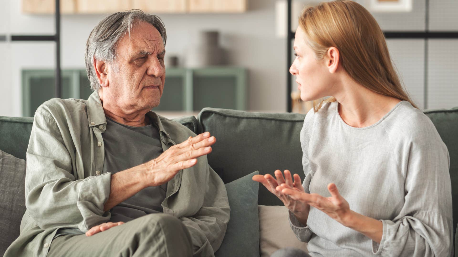 man talking to his daughter with differing opinions