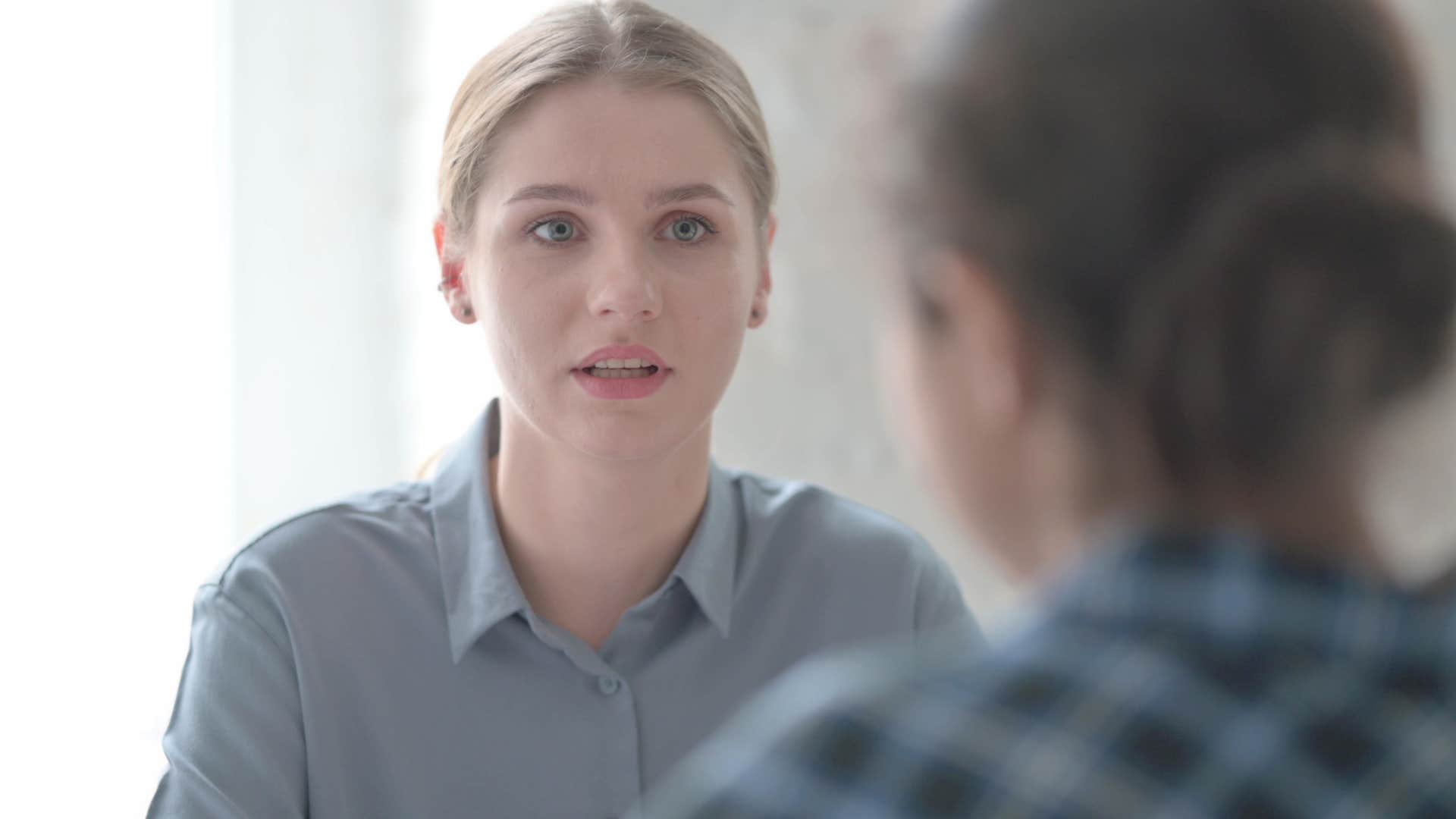 Woman saying it's nuanced to a co-worker