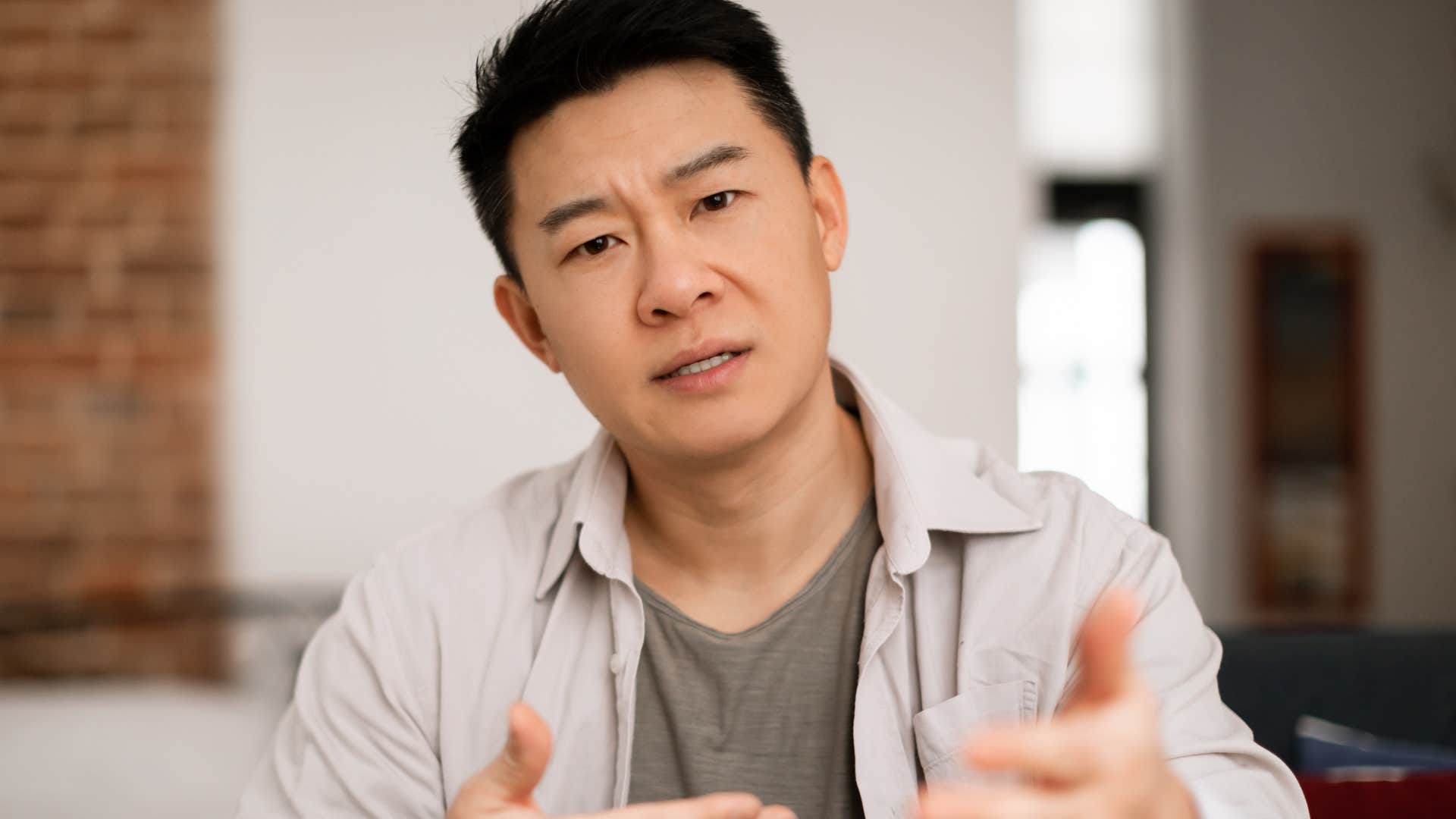 Man saying let me break it down for you to someone