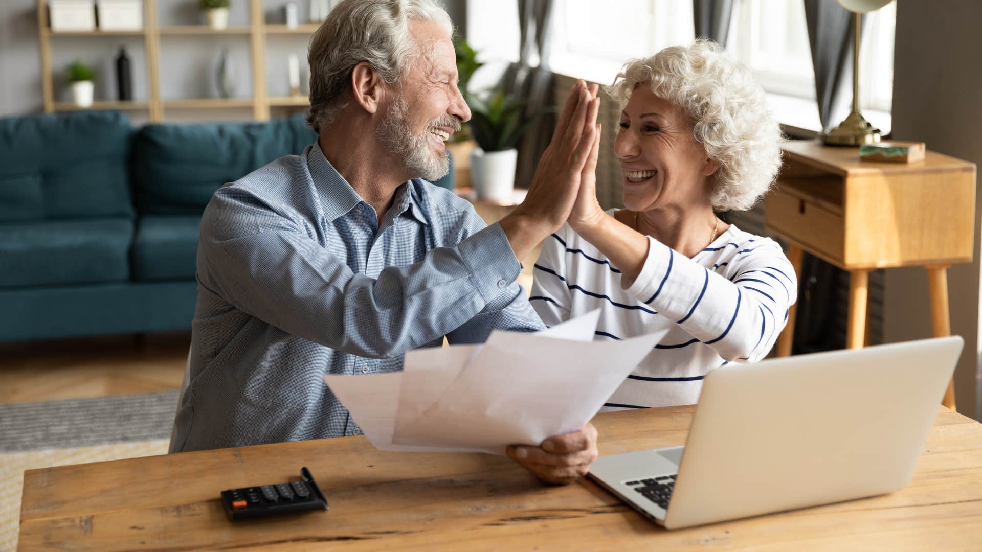 couple high fiving each other with pride