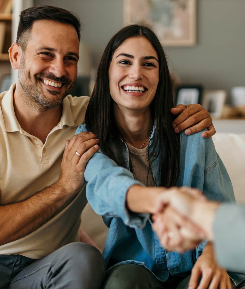 Happy couple shake hands with therapist showing integrity in marriage
