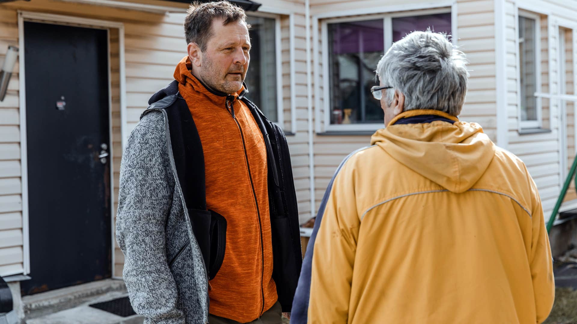 Man saying "that crossed a line" to a family member outside.