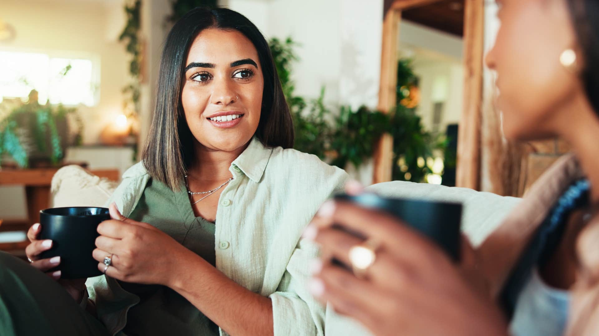 wealthy woman telling friend to hire someone for help
