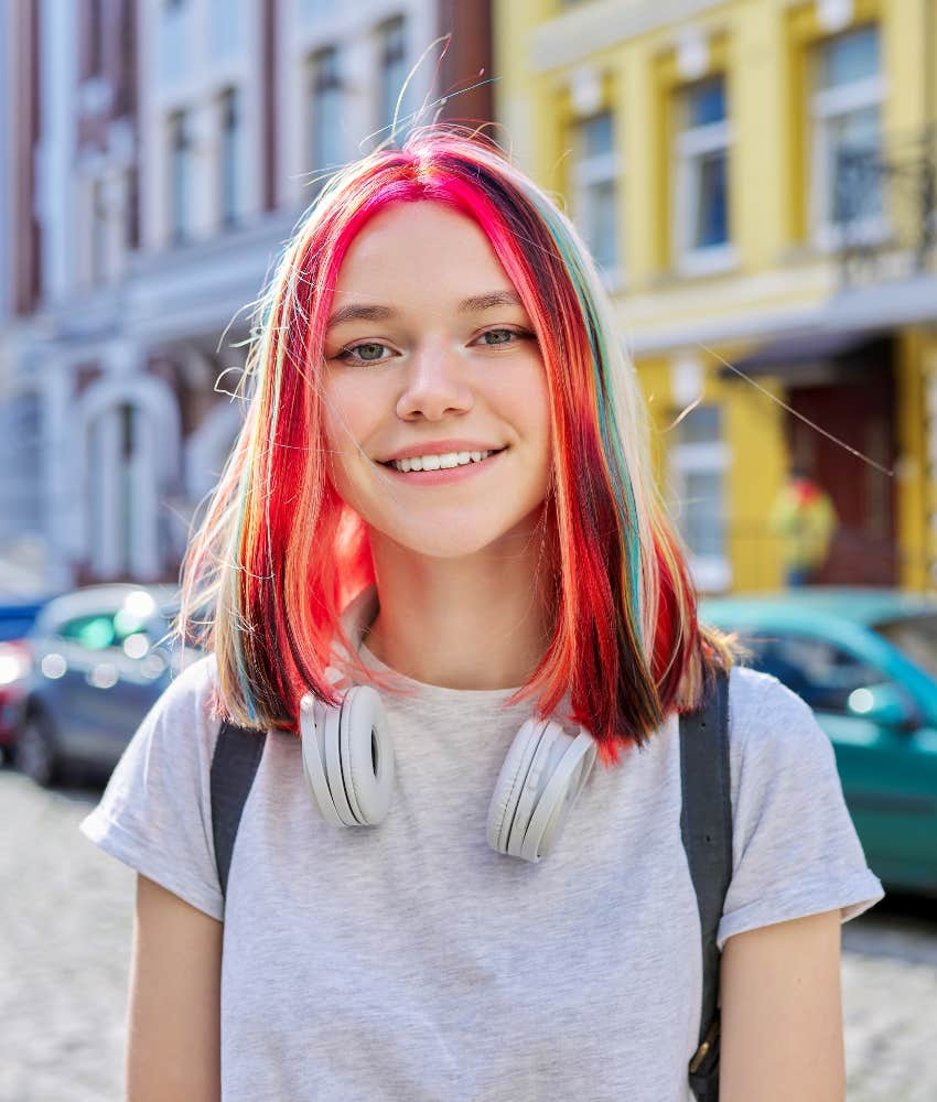 teenage girl with colored hair smiling