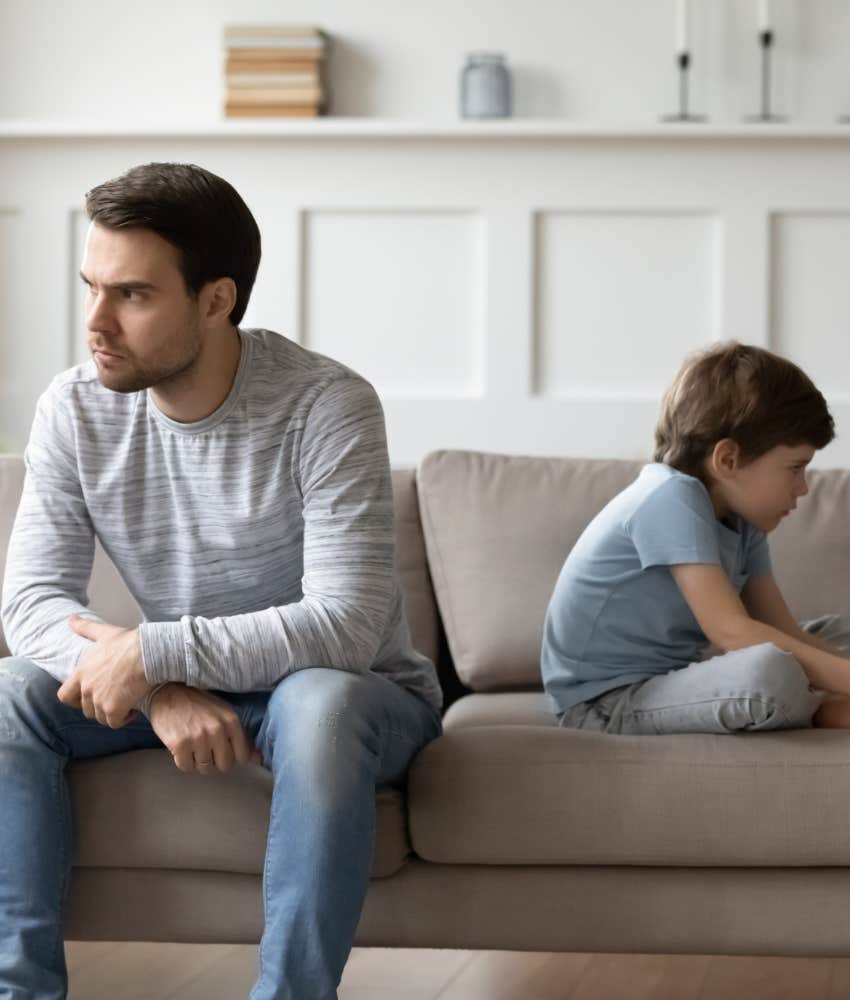 unhappy parent and child sit back to back showing emotional neglect repeats