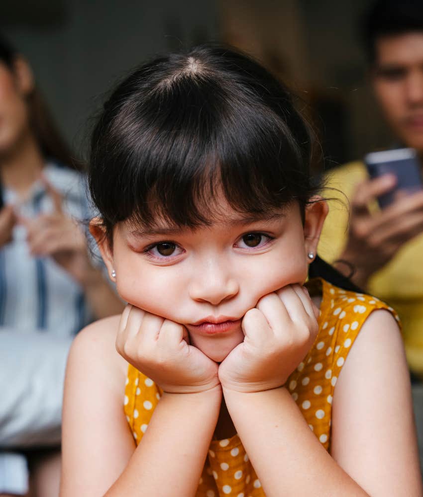 Unhappy child not supported by parents showing emotional neglect
