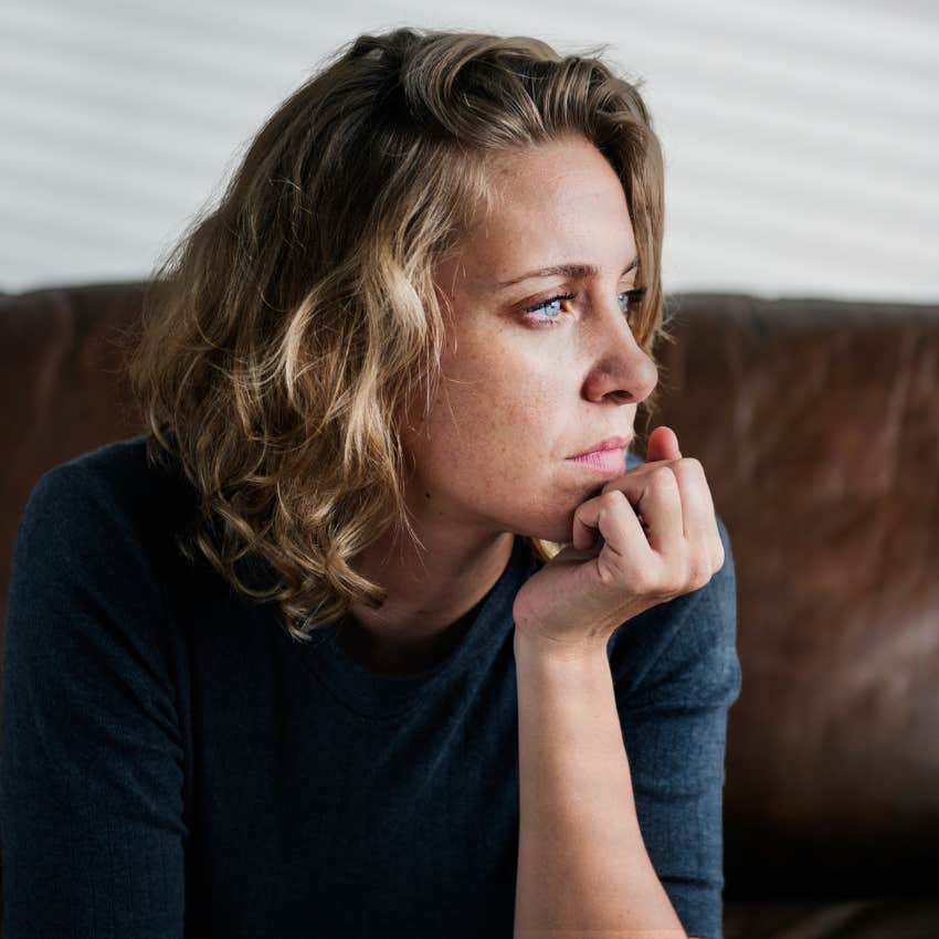 Woman creating space and sitting alone at home