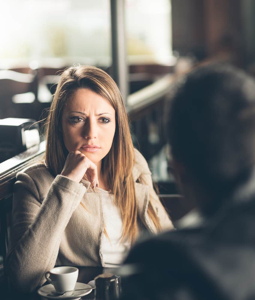 Annoyed woman listens to date talk about ex showing person on rebound