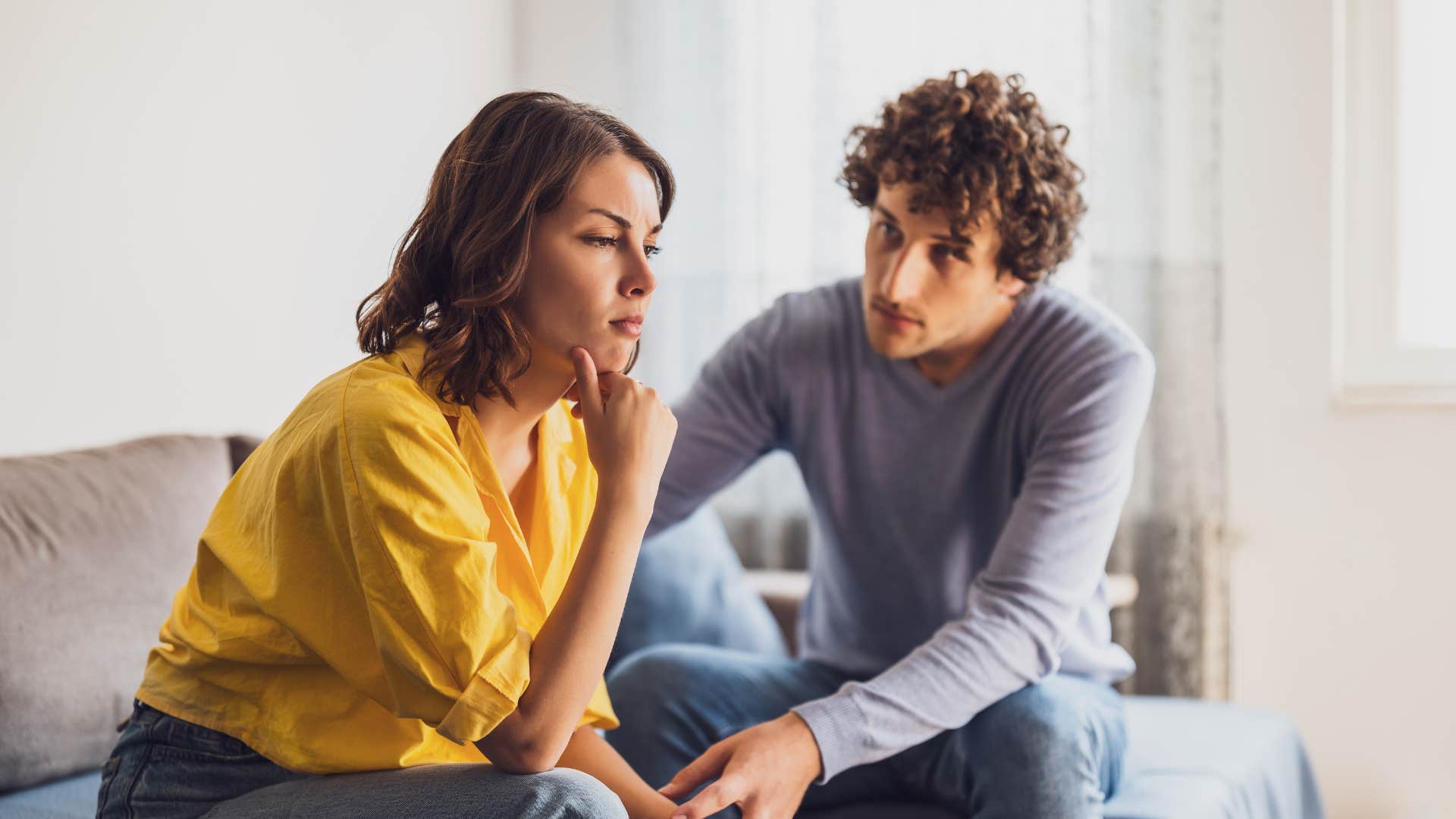 brilliant woman being comforted by man