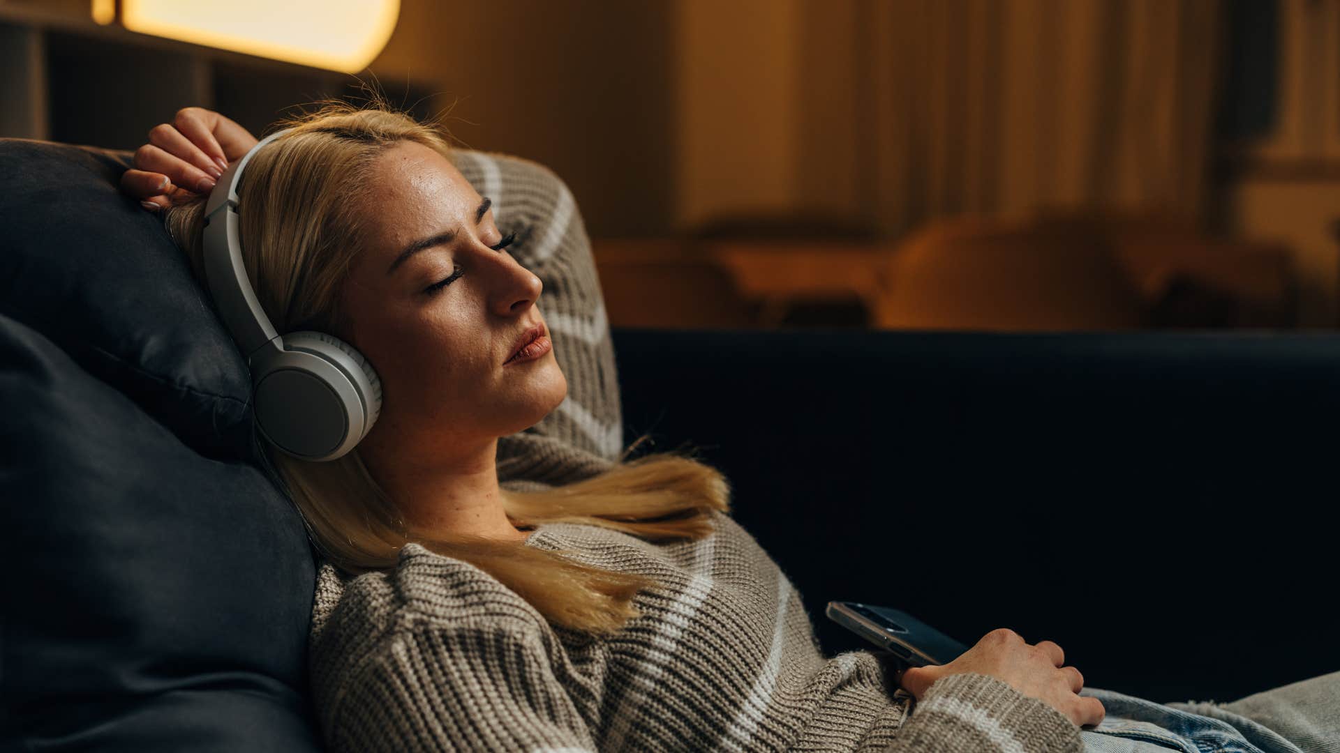 brilliant woman relaxing in headphones