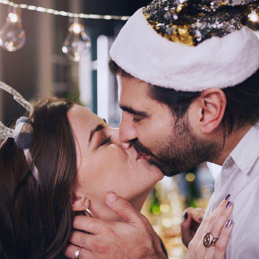 couple kissing on new year's eve because of folklore
