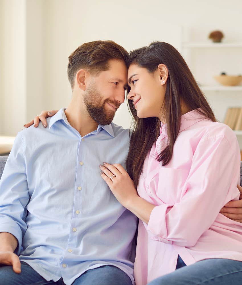 Happy couple forehead to forehead showing good relationship feelings
