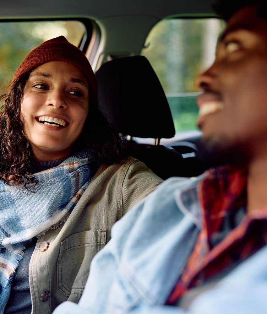 Smiling couple make eye contact showing they say yes to relationship