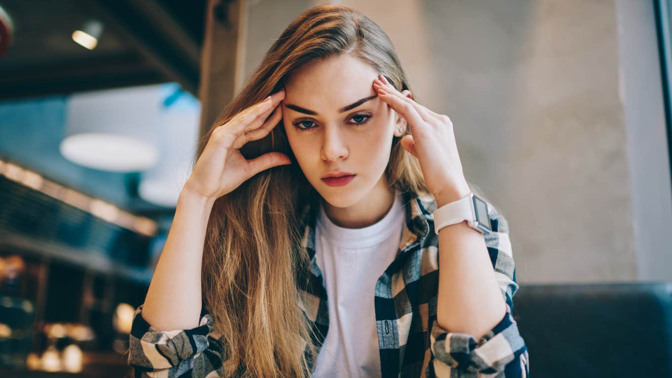 stressed gen z woman looking exhausted