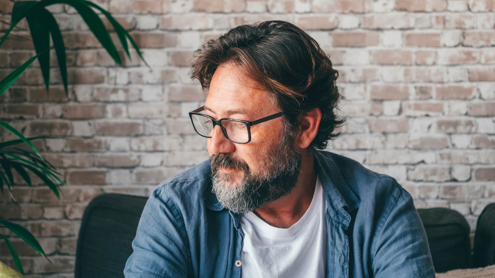 man in glasses has a hard time being vulnerable