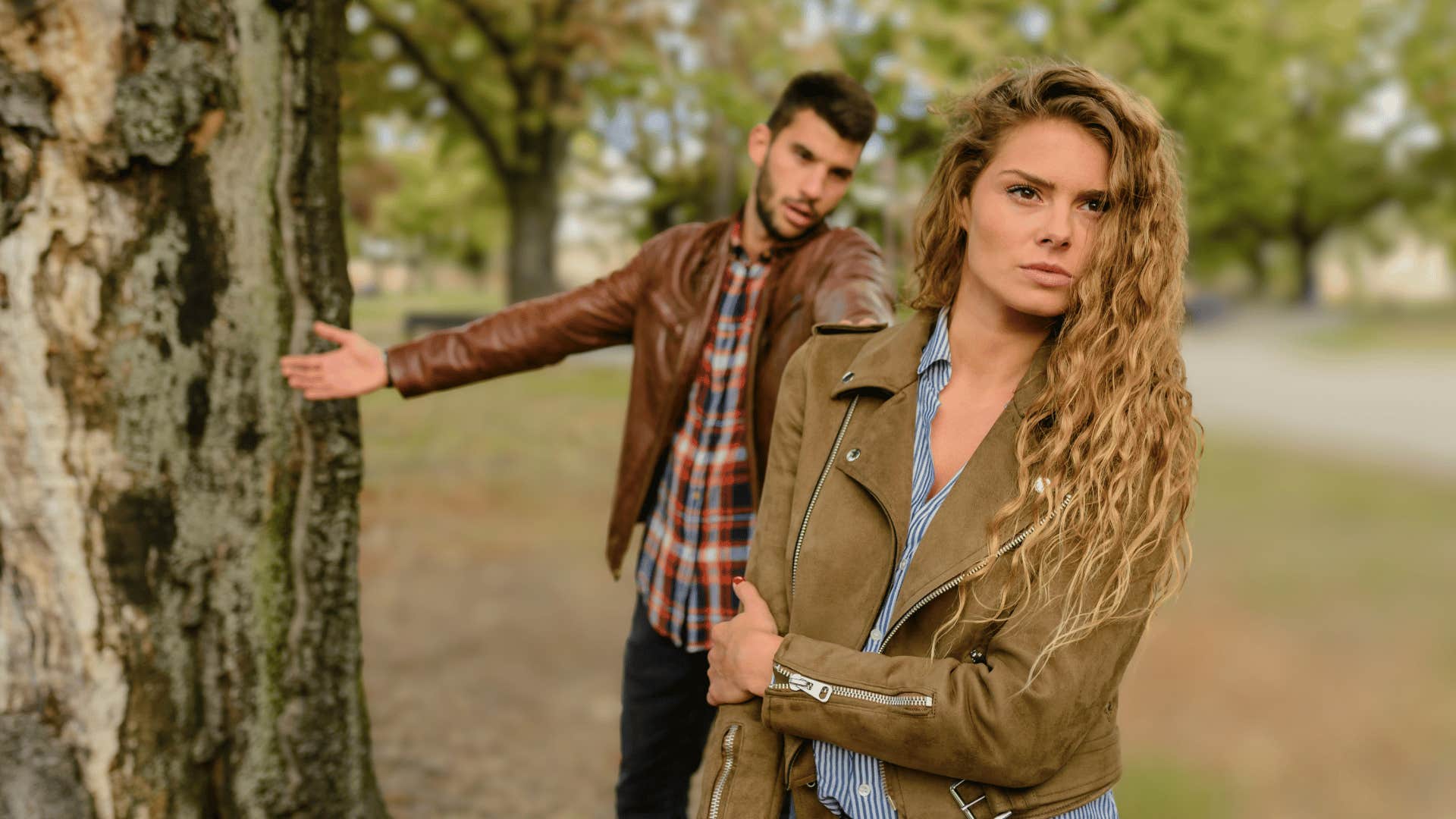 young woman walking away from man