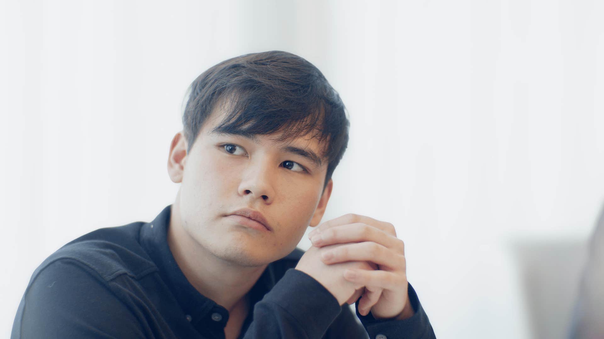 thoughtful man staying silent