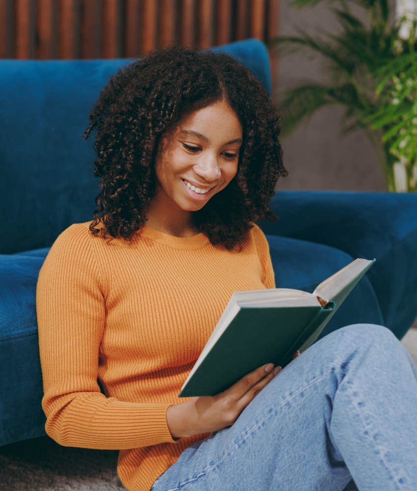 happy teenage girl reading book