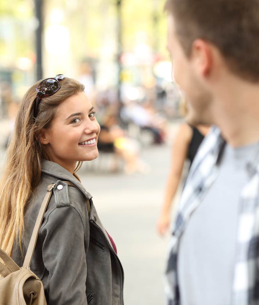 Happy passers by catch each other in a moment of love