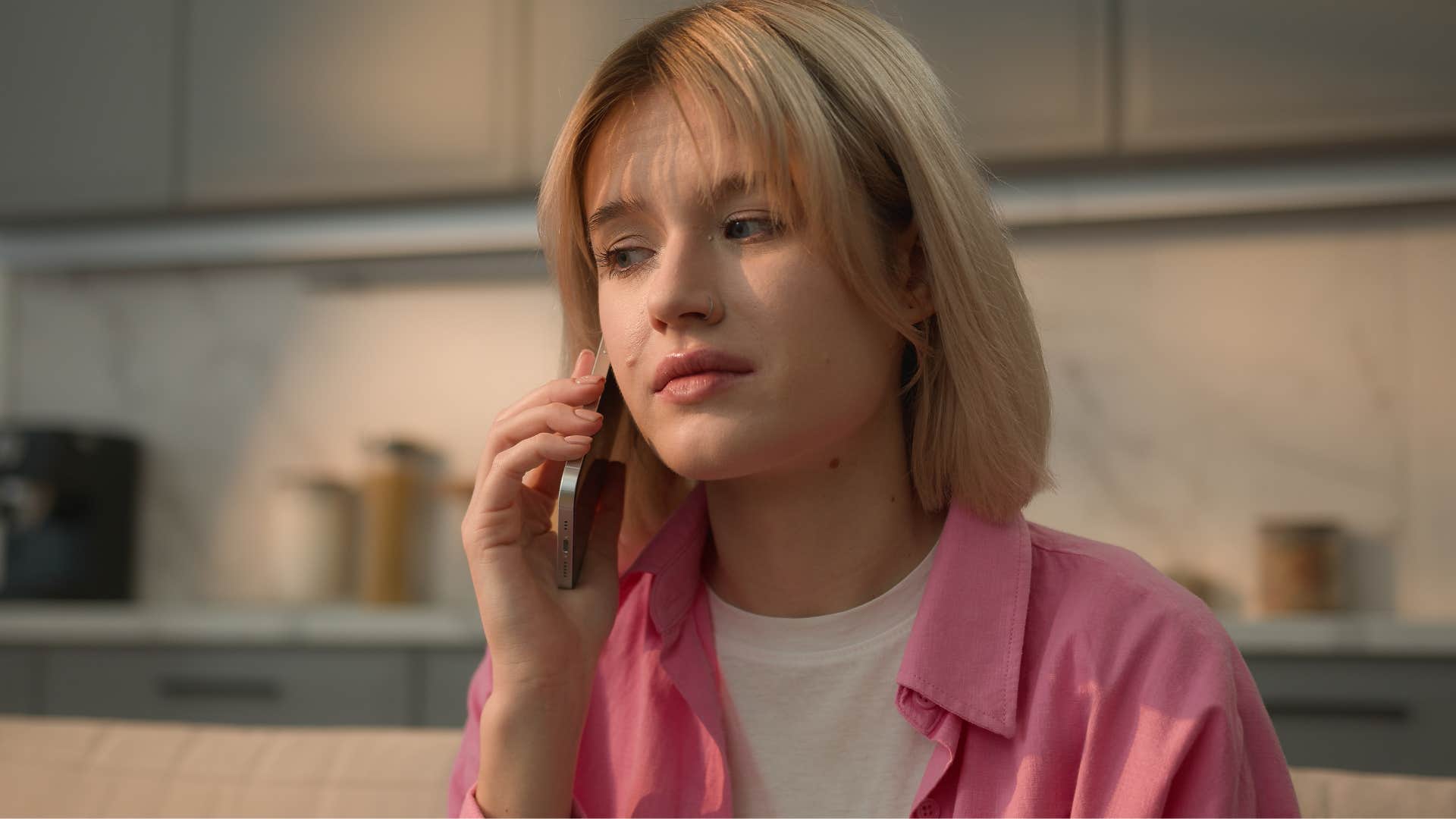 woman on the phone asking everyone else what they're wearing