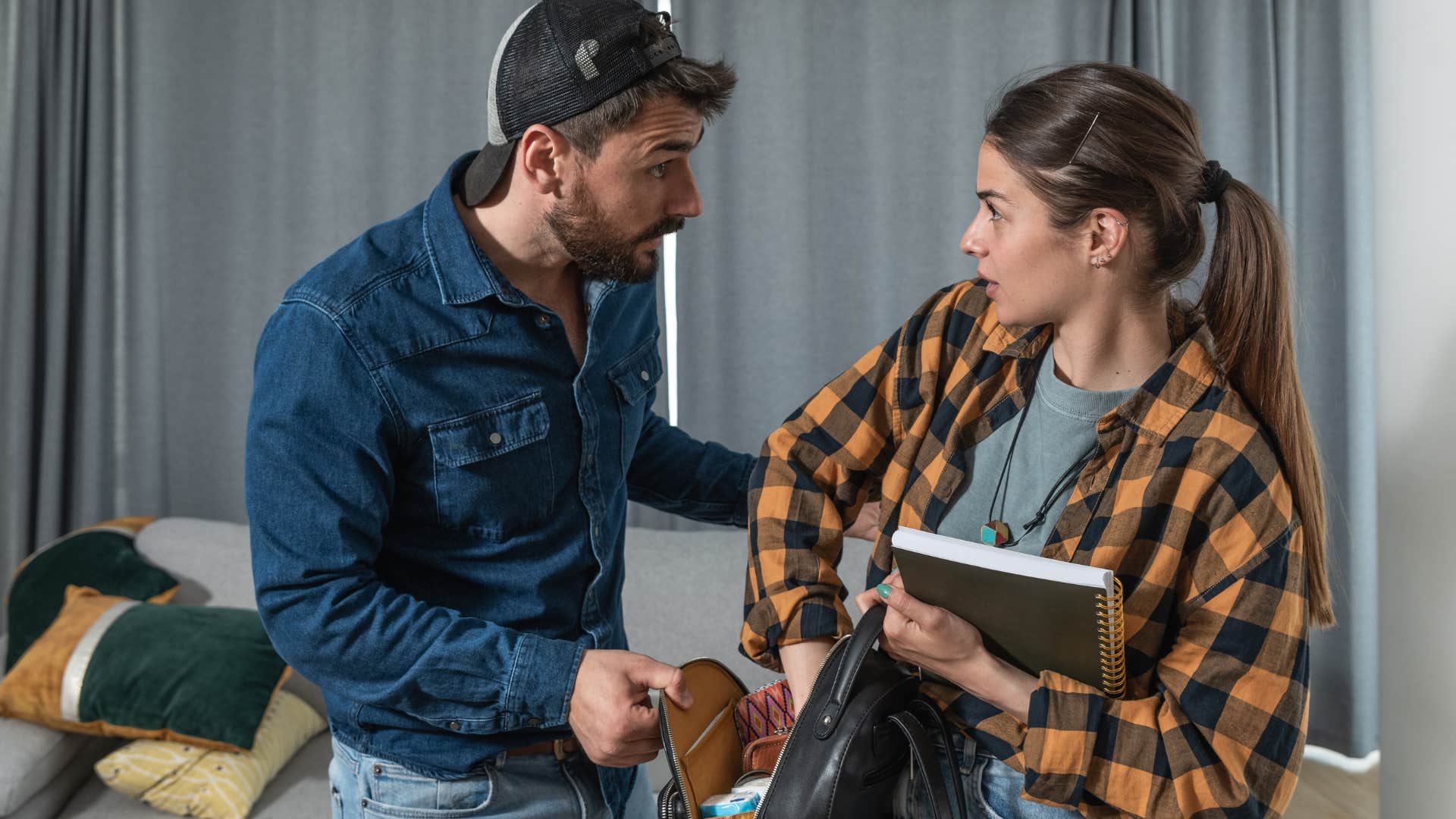 forgetful man arguing with his wife at home