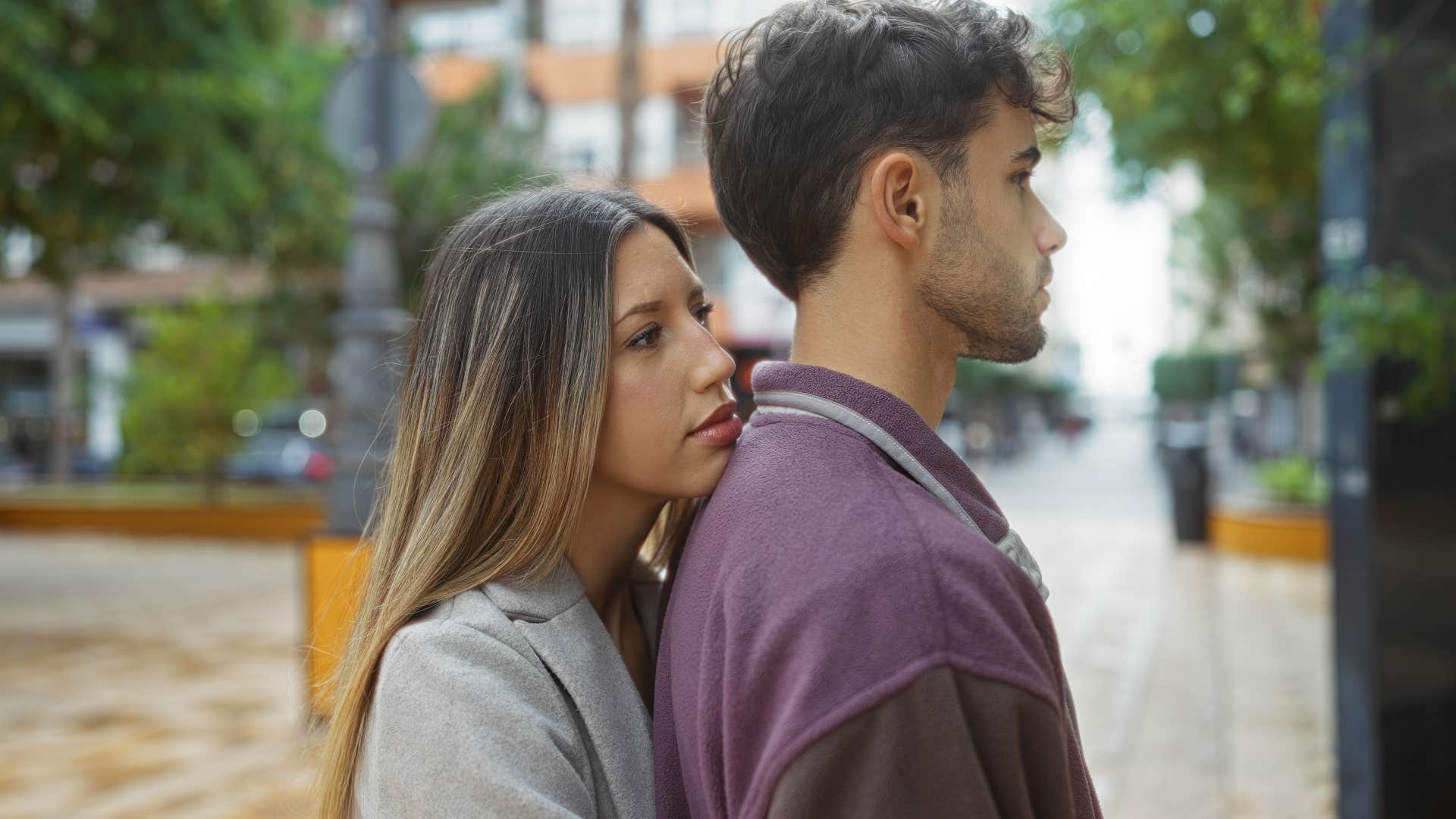 a needy woman hangs onto him in public which drives her man away 