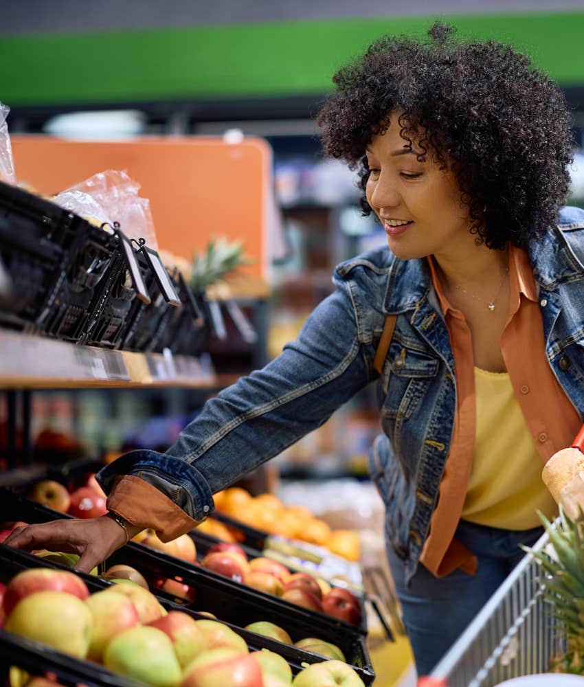 Happy person chooses fruit showing daily food habit to change life