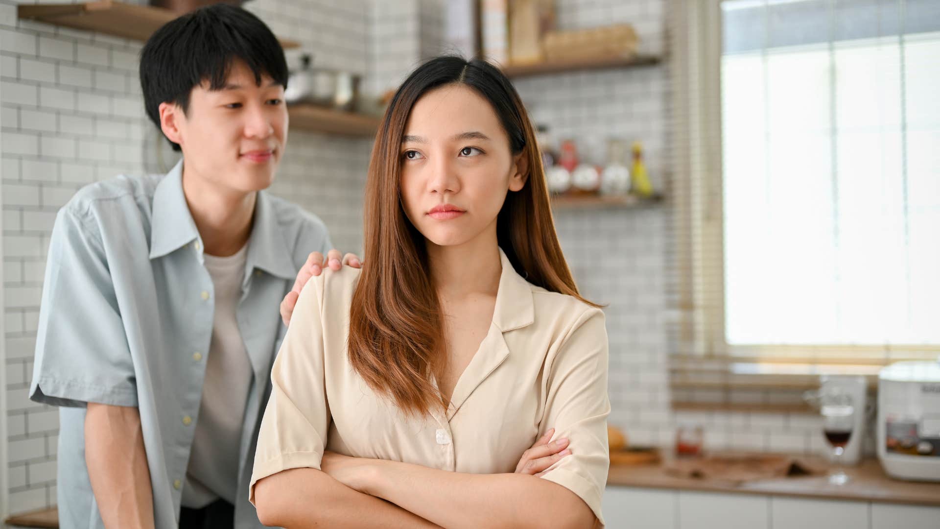 concerned man apologizing to upset wife