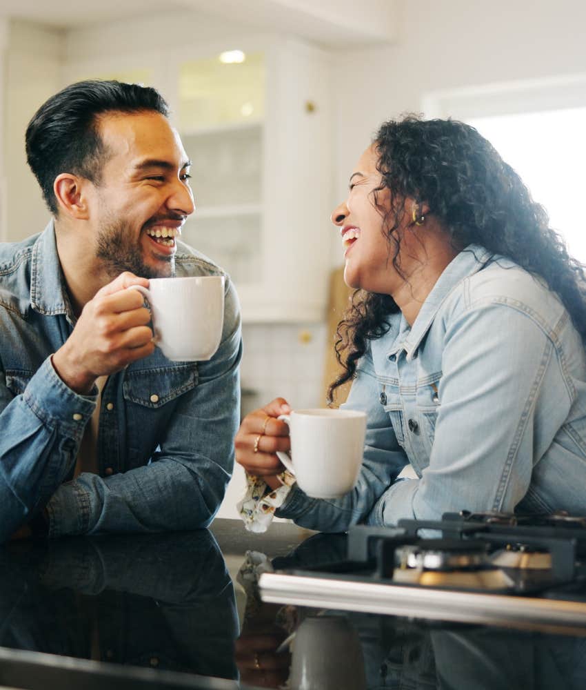 Happy couple drink coffee passionately showing they are madly in love