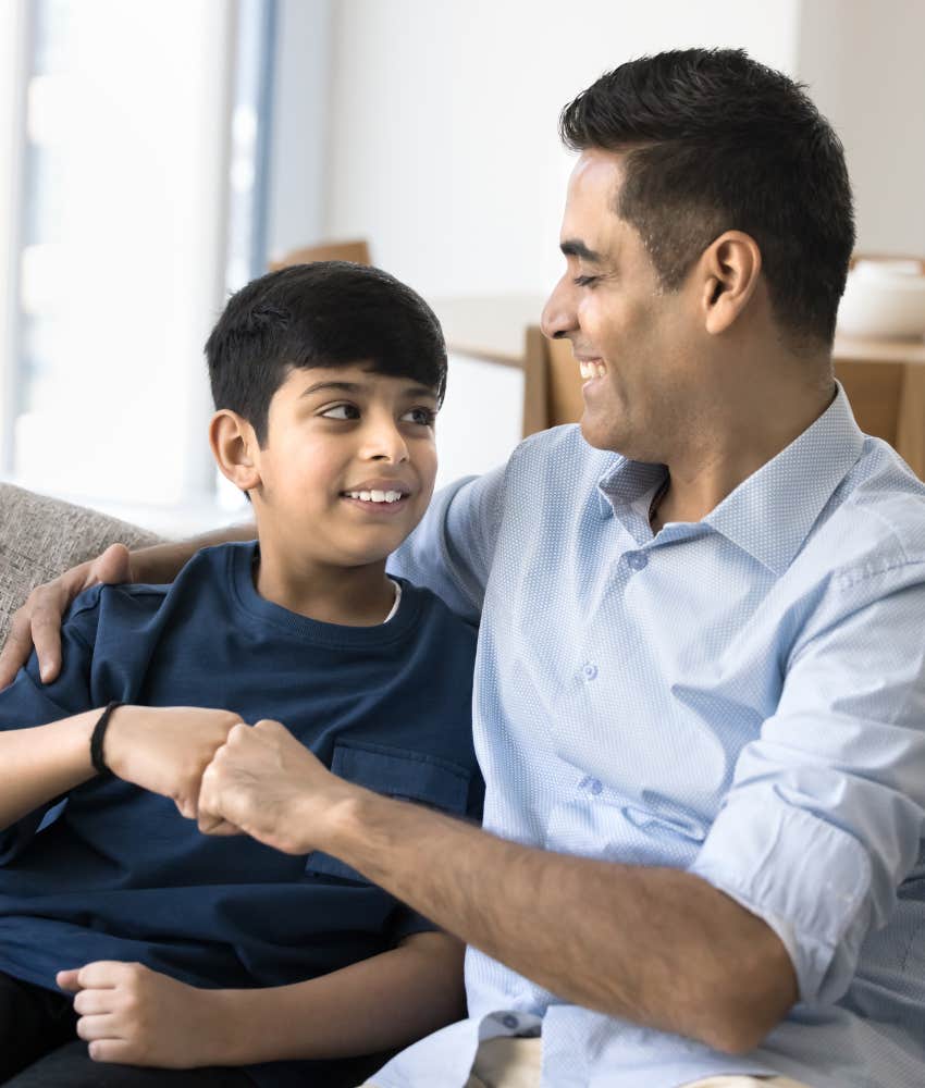 Decent parent fist bumps with child showing importance of admitting mistakes