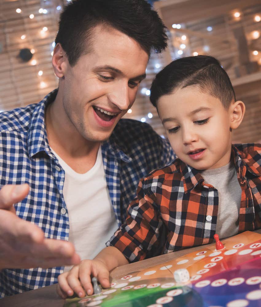 Genuinely decent parent plays games with child showing importance of mistakes