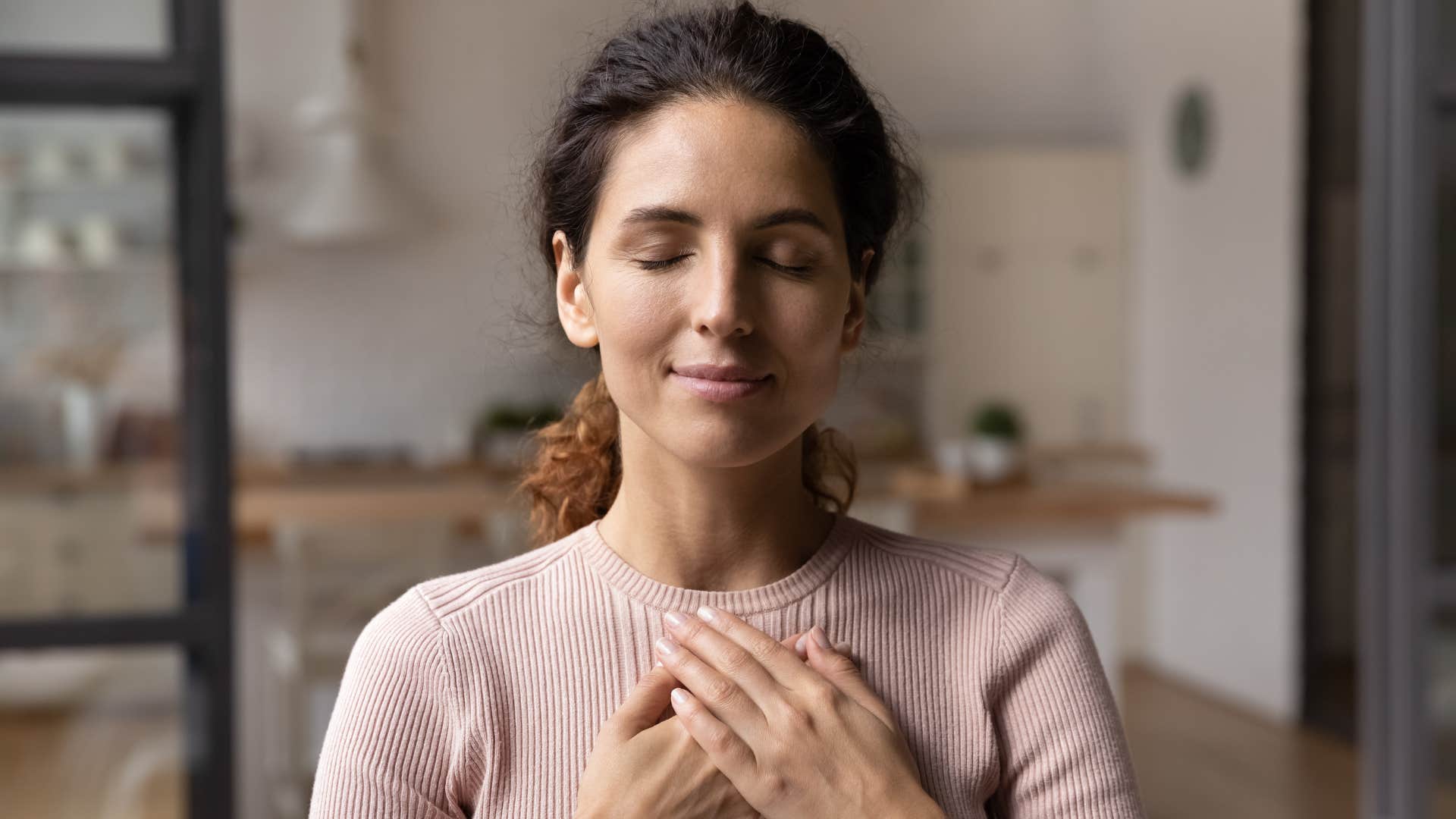 woman who feels good more days than not as she embraces peace