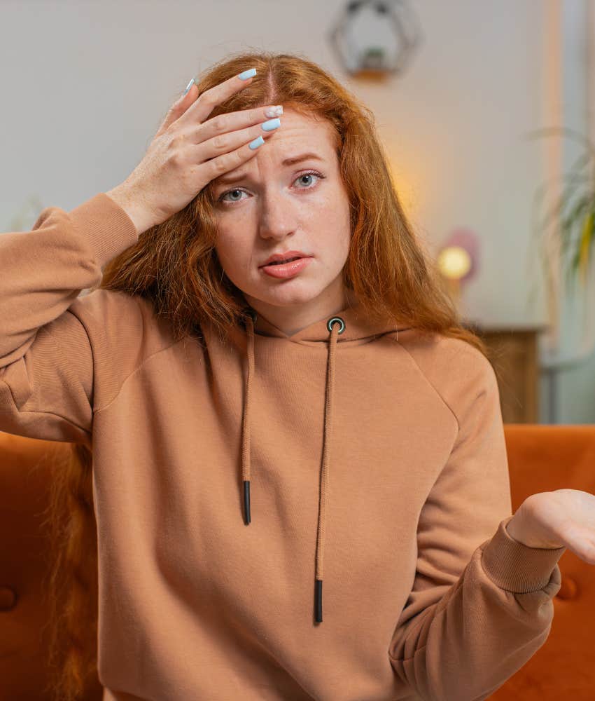 Uncertain person touches forehead showing difficulty admitting feeling lost